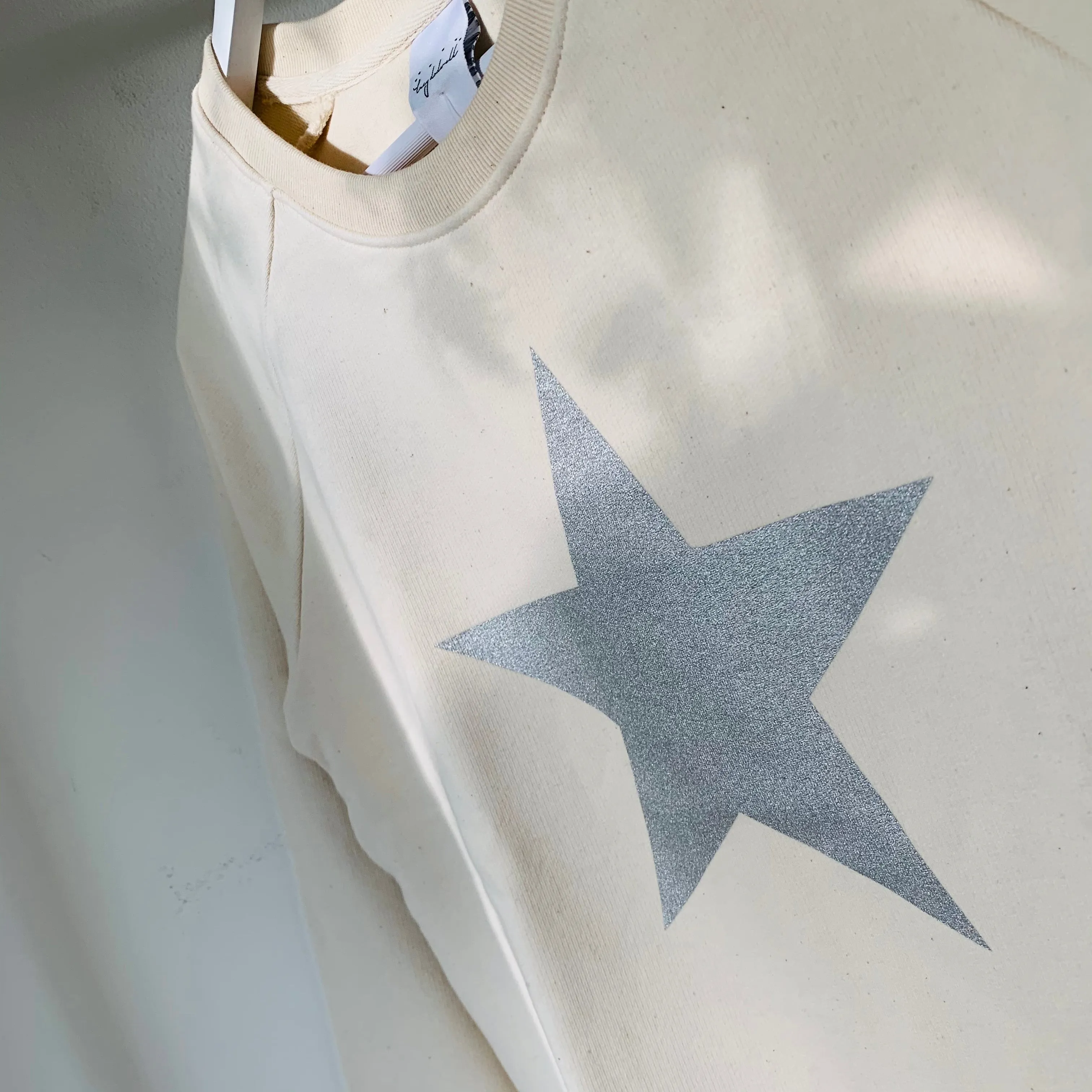 Glittery grey star cream raw sweatshirt